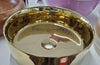 Dinan polished gold bathroom vessel sink. Shiny finish