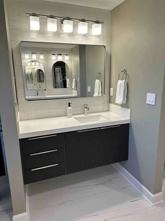 56" custom bathroom vanity. 2 doors, 3 drawers. White quartz countertop mitered. White ceramic undermount sink.