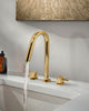 Origin widespread bathroom sink faucet. Polished gold